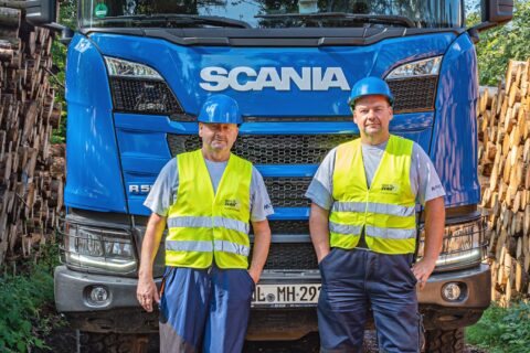 Two Mercer Holz drivers with new Scania Timber Truck with loading crane