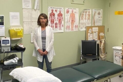 Jan Summersides, Mercer Celgar's on-site Physiotherapist, working with mill employees in Castlegar, BC, Canada