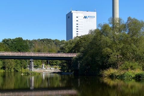 Mercer Rosenthal mill across a river in Rosenthal am Rennsteig, Germany