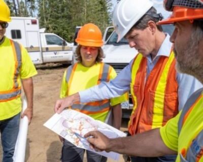 Four Mercer team members reviewing work site map for Mercer Forestry Services operations