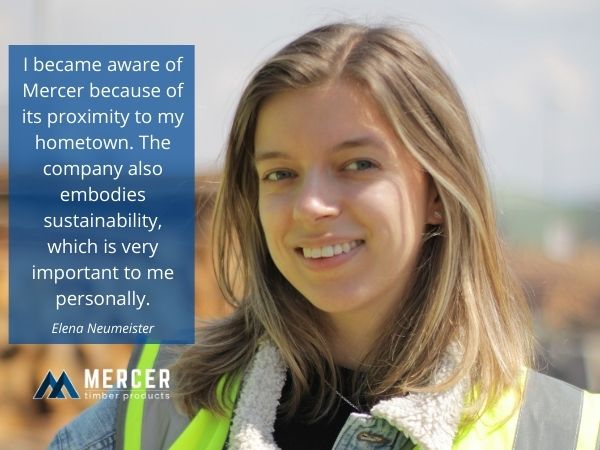 Elena Neumeister, MTP trainee, stands in the log yard 2022