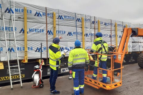 Mercer Timber Products team members using new crane arm technology to assist in loading lumber pallets more safely